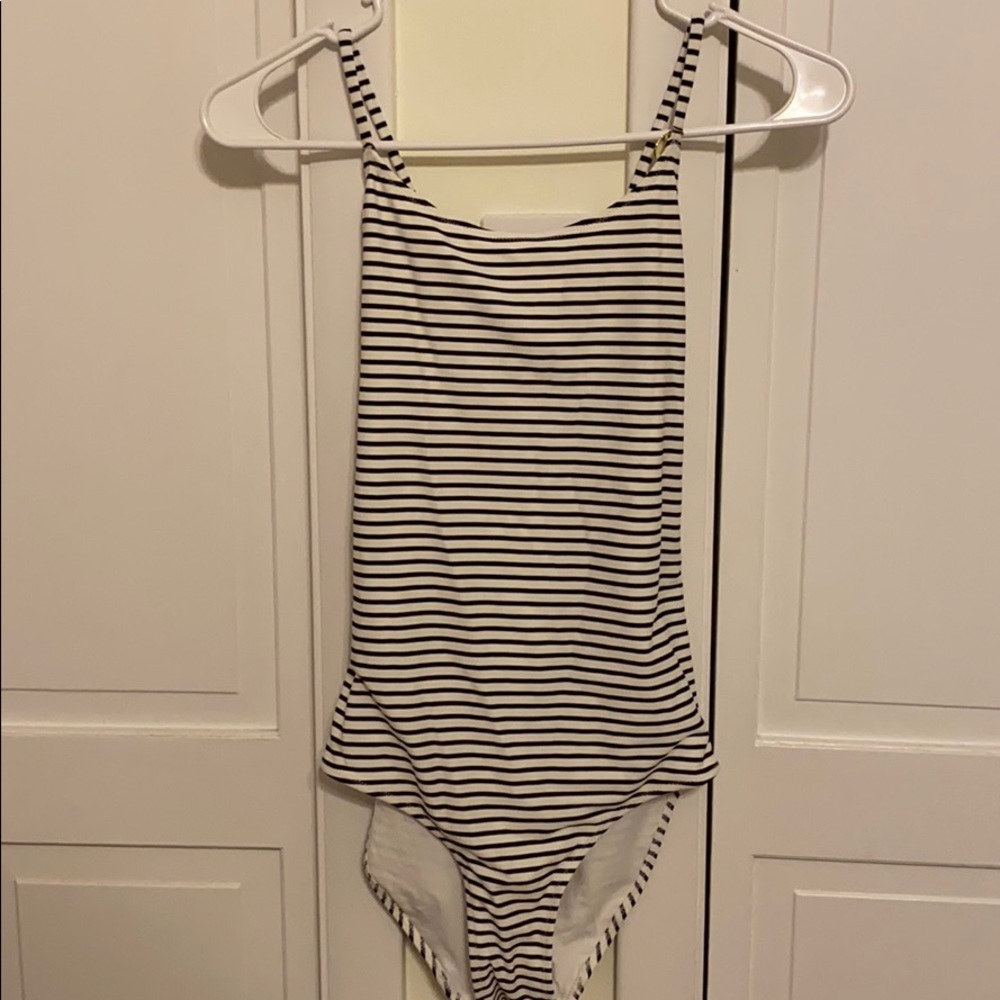 Never worn, white one piece swim suit